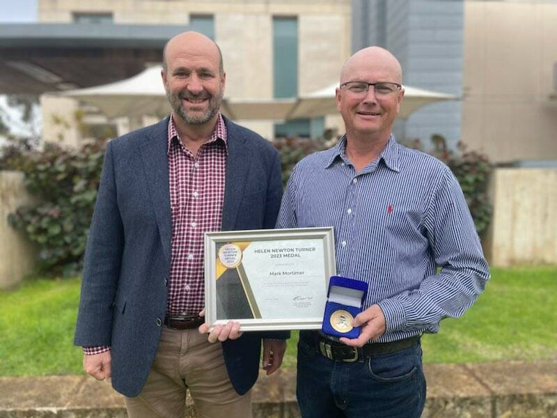 Tullamore's Mark Mortimer (right) with the prestigious award. Picture supplied.