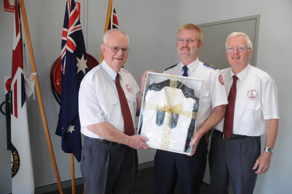 Dubbo District Band president Tony Wheatland, Ambulance Service of NSW Central West zone manager Brad Porter and Dubbo District Band secretary Don Nicholson.