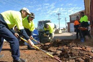 Jeff Dandridge and Ronald West begin work at the site of the old Dubbo fire station.